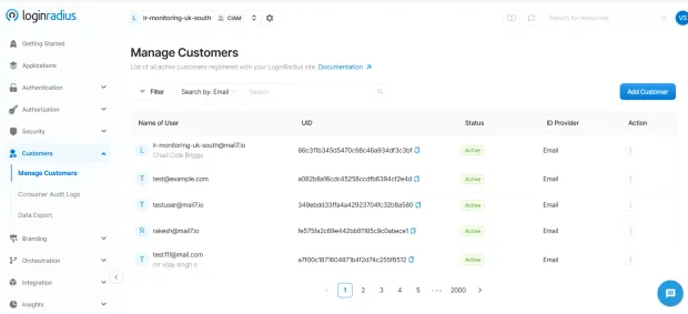 LoginRadius dashboard Manage Customers page showing a list of active users with email, UID, status, and ID provider. Sidebar menu on the left with navigation options.