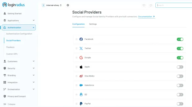 Illustration showing LoginRadius console showing social providers, including facebook, twitter, google, apple, sina weibo, salesforce, qq, paypal configuration.